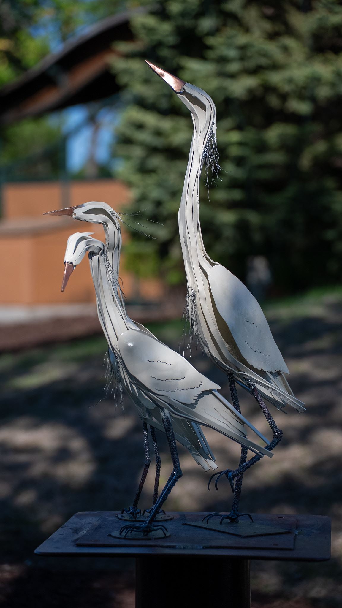 Image of a welded steel sculpture of 3 marsh birds, approximaelty life size