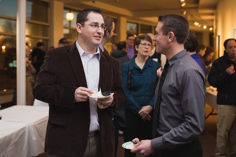 Two men at party at the Hopkins Center for the Arts